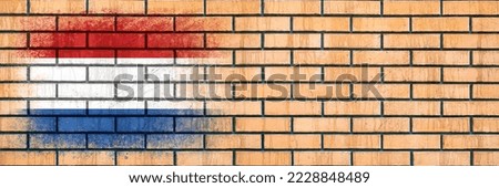 Flag of Netherlands. Flag painted on a brick wall. Brick background. Copy space. Textured creative background