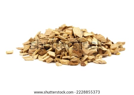 Wood chips for smocking isolated on white background. Natural apricot wood smoking chunks Royalty-Free Stock Photo #2228855373