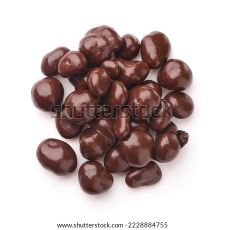 Top view of dark chocolate covered raisins isolated on white