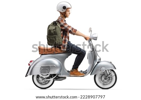 Male student with a helmet riding a scooter isolated on white background Royalty-Free Stock Photo #2228907797