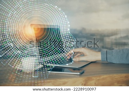 Businessman with computer background with brain theme hologram. Concept of brainstorm. Multi exposure.