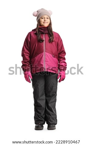 Full length portrait of a girl wearing waterproof winter clothes isolated on white background