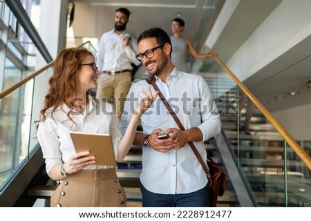 Business people having fun, teamwork and chatting at workplace office together. Royalty-Free Stock Photo #2228912477