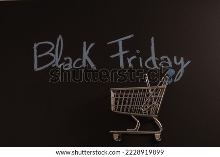 shopping cart on black background with Black Friday text