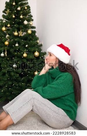 Christmas. Depression. A young woman is sad during the holiday. Loneliness. Stress. Illness. Mental health. Lifestyle. High quality photo