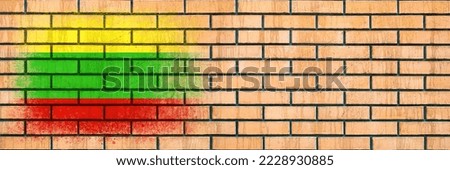 Flag of Lithuania. Flag painted on a brick wall. Brick background. Copy space. Textured creative background