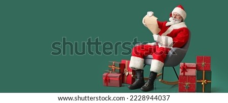 Santa Claus reading wish list on green background with space for text