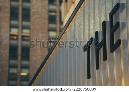 the letters of the word were written on the wall of a tall building in New York.
