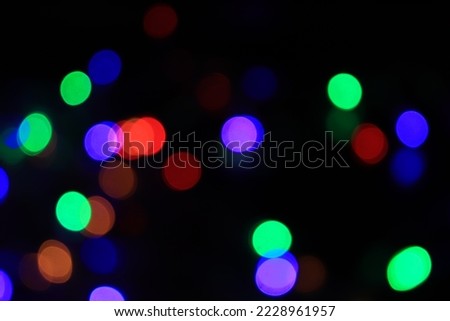 Purple Festive Christmas background. Elegant abstract background with bokeh defocused lights and stars
