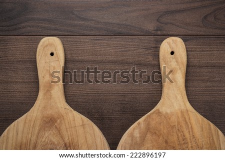 old cutting boards on the wooden table