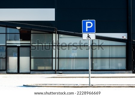 Parking lot for persons using wheelchair on the area in front of big retail building