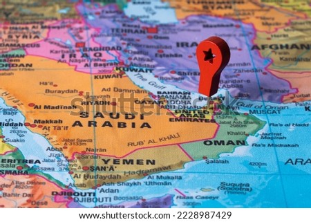 Red pin, point on the map of United arab. Concept travel background Royalty-Free Stock Photo #2228987429
