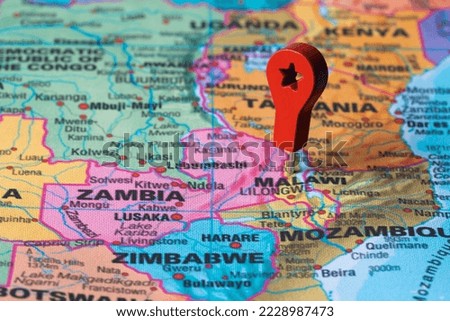 Red pin, point on the map of Malawi. Concept travel background