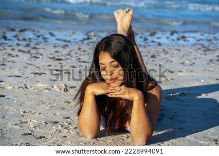 beautiful black hair girl mexican latina portrait on the beach in baja california sur
