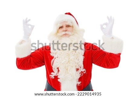 Santa Claus shows fingers sign class or ok on a white background. The concept of Christmas and New Year sales. the tradition of buying and giving gifts.