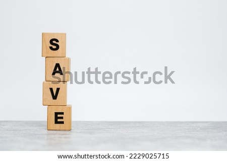 The word Save is written on wooden blocks over the desk and copy space for your text.  with copy space.                 