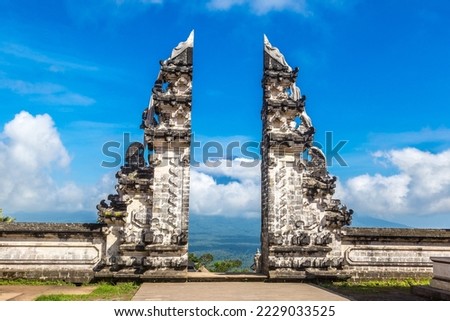 Ancient gate at Pura Penataran Agung Lempuyang temple and volcano Agung on Bali, Indonesia in a sunny day Royalty-Free Stock Photo #2229033525