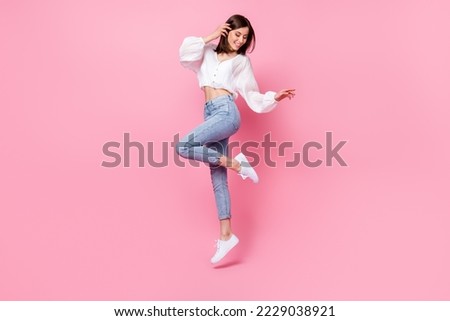Full length photo of cute lady skinny figure look empty space footwear satisfied trendy purchase outfit isolated on pink color background Royalty-Free Stock Photo #2229038921