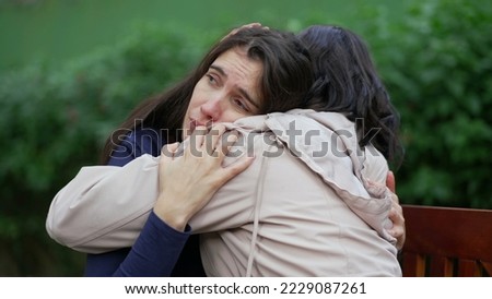 Sad woman suffering from negative emotion. Two women embracing each other with EMPATHY Royalty-Free Stock Photo #2229087261