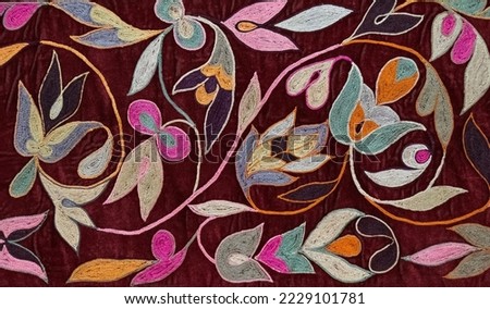 Colorful floral embroidery on velvet in Central Asian style Royalty-Free Stock Photo #2229101781