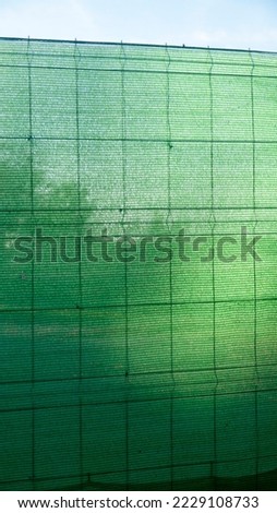 Green sheet fence in rural area