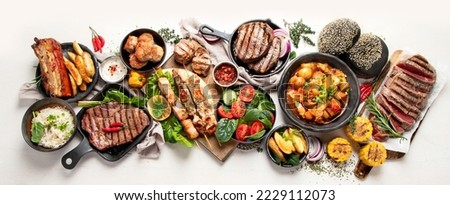 Meat dishes. Plates of various meat. Non vegetarian food banner. Top view. Panorama, banner Royalty-Free Stock Photo #2229112073
