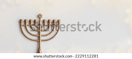 Hanukkah card design with golden symbols on white background for Jewish holiday Hanukkah. Banner.  Cope space