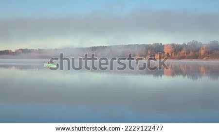 Fog on shores of Finnish Tuusula lake: morning, autumn, calm.