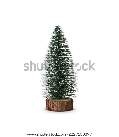 Decorative mini Christmas tree isolated on white background.