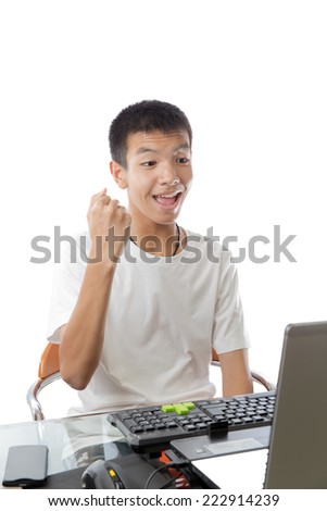 Asian teenager express himself while using computer