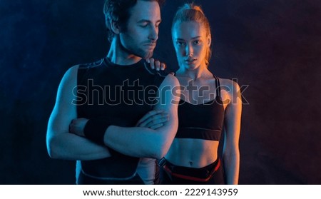 Sprinter run. Strong athletic woman and man rest after running on black background. Fitness and sport motivation. Runner concept.