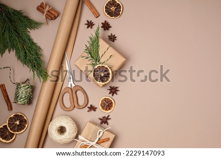 Christmas background with gift boxes and kraft wrapping paper. Xmas celebration, preparation for winter holidays. Festive mockup, top view, flatlay