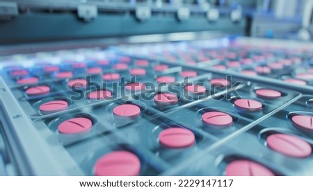 Macro Shot of Pink Pills During Production and Packing Process on Modern Pharmaceutical Factory. Medical Drug Manufacturing. Royalty-Free Stock Photo #2229147117