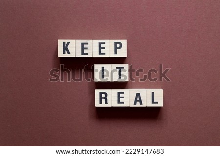 Keep it real - word concept on cubes