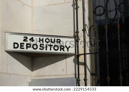Vintage traditional 24 hour bank depository window. Royalty-Free Stock Photo #2229154533