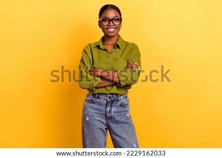 Portrait of attractive cheerful brunette girl hr executive expert folded arms isolated over bright yellow color background Royalty-Free Stock Photo #2229162033
