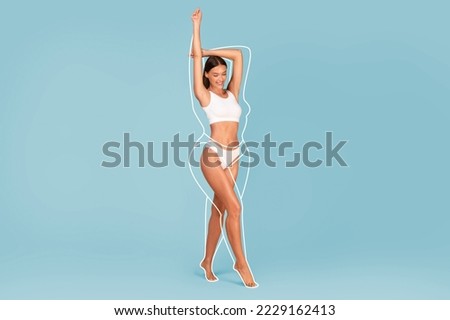 Slimming Concept. Beautiful Slim Female In Underwear With Drawn Outlines Around Her Body Standing On Blue Studio Background, Fit Young Wman Raising Hands And Smiling, Copy Space, Collage