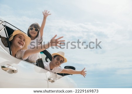 Happy family day. Asian Dad, mom and daughter little kid smiling sitting in compact car windows raise hand wave goodbye, Summer at beach, Car insurance, Family holiday vacation travel, road trip