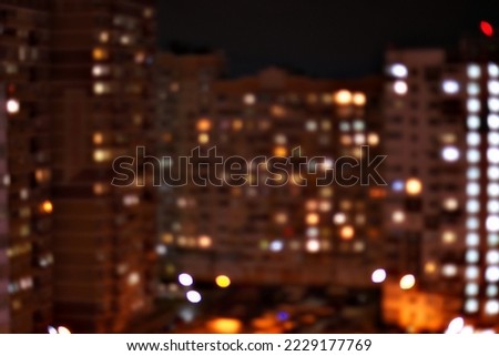 View from the high-rise window to the night city after the rain, bokeh, blurred focus, background, banner Royalty-Free Stock Photo #2229177769