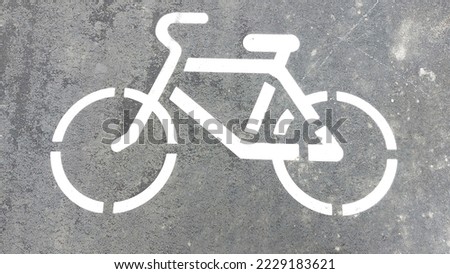 Bike path sign on asphalt