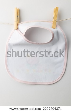 Close up of baby bib on white background. Clothing and accessories, newborn and infant childcare concept.