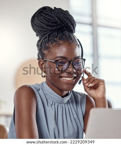 Thank you for calling our customer care line. Shot of a young woman using a headset in a modern office. Royalty-Free Stock Photo #2229209349
