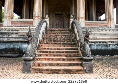 vintage old aged giant snake, Naka, south east asian Dragon on a temple staircase with typical cultural decorative ornaments in Wat Phra Kaew, Vientiane, Laos