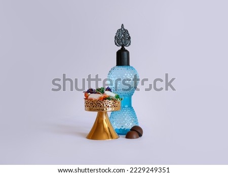 Cologne bottle, chocolate and candy isolated. Happy Ramadan, happy kurban.(Turkish translate: Bayraminiz kutlu olsun. Kolonya şişesi, çikolata ve şeker. Ramazan bayrami ve kurban bayrami.)