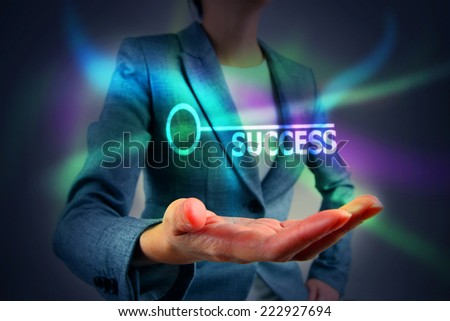 Business person touching key success