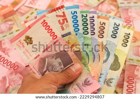 indonesian money, new series rupiah of banknote. rupiah money with blur background. Rupiah money from indonesia. Rupiah money for buying and selling transactions. Royalty-Free Stock Photo #2229294807