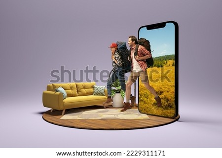 Dreams. Happy young couple, smiling man and woman going to vacation trip using 3d model of phone isolated on grey background. New app, holiday, hobbies, travel, ad concept