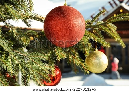 Christmas tree with baubles outdoor in winter season