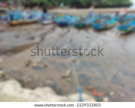 blur background with fishing boats on the beach