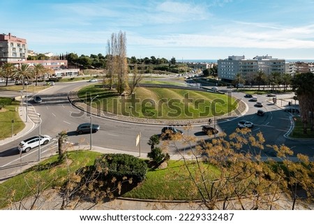 Street road roundabout or circle intersection of car traffic on sunny day in Mataro, Spain